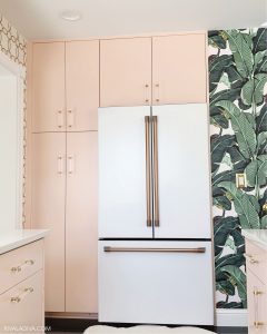 Beverly Hills inspired kitchen with Blush pink caninets and Cafe 23.1 cu. ft. Smart French Door Refrigerator in Matte White